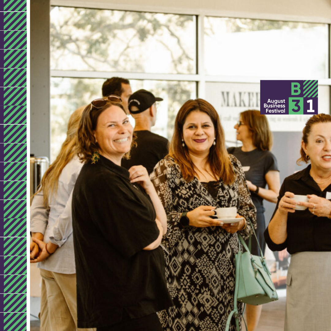 People networking at August Business Festival event.