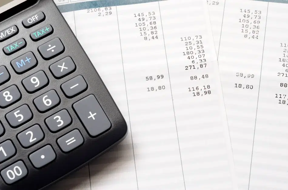 Calculator and printed financial receipts close-up.