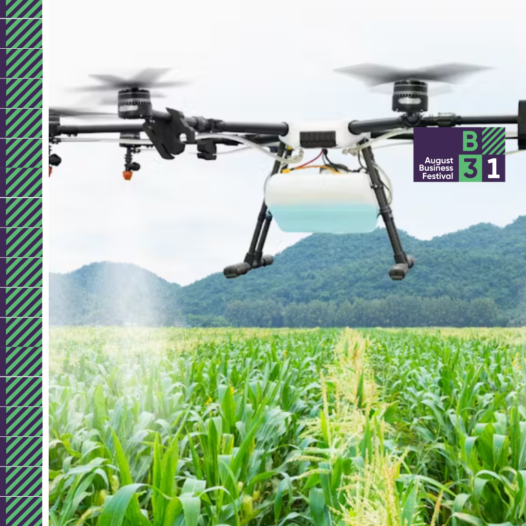 Drone spraying crops in agricultural field.
