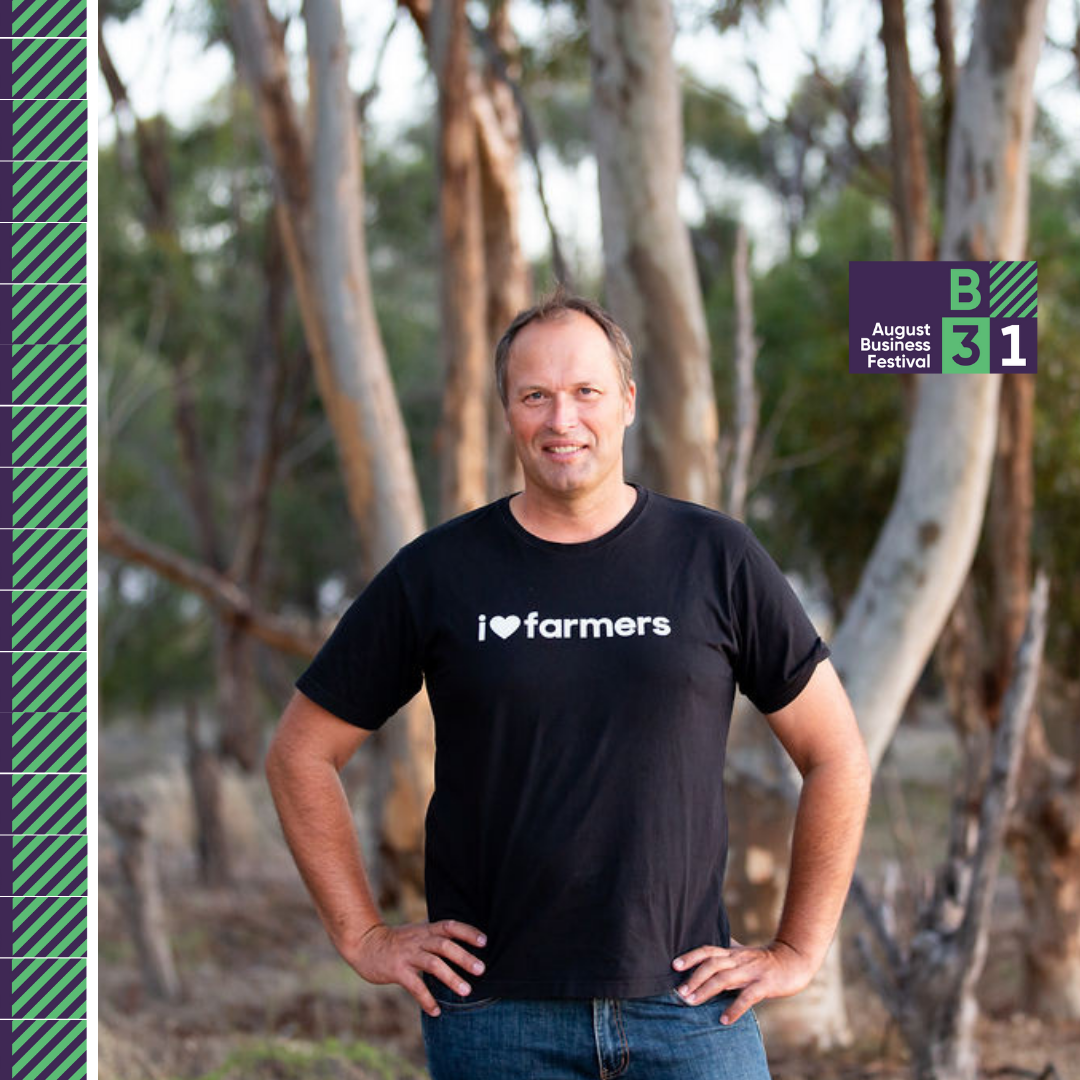 Smiling man in forest supports farmers.