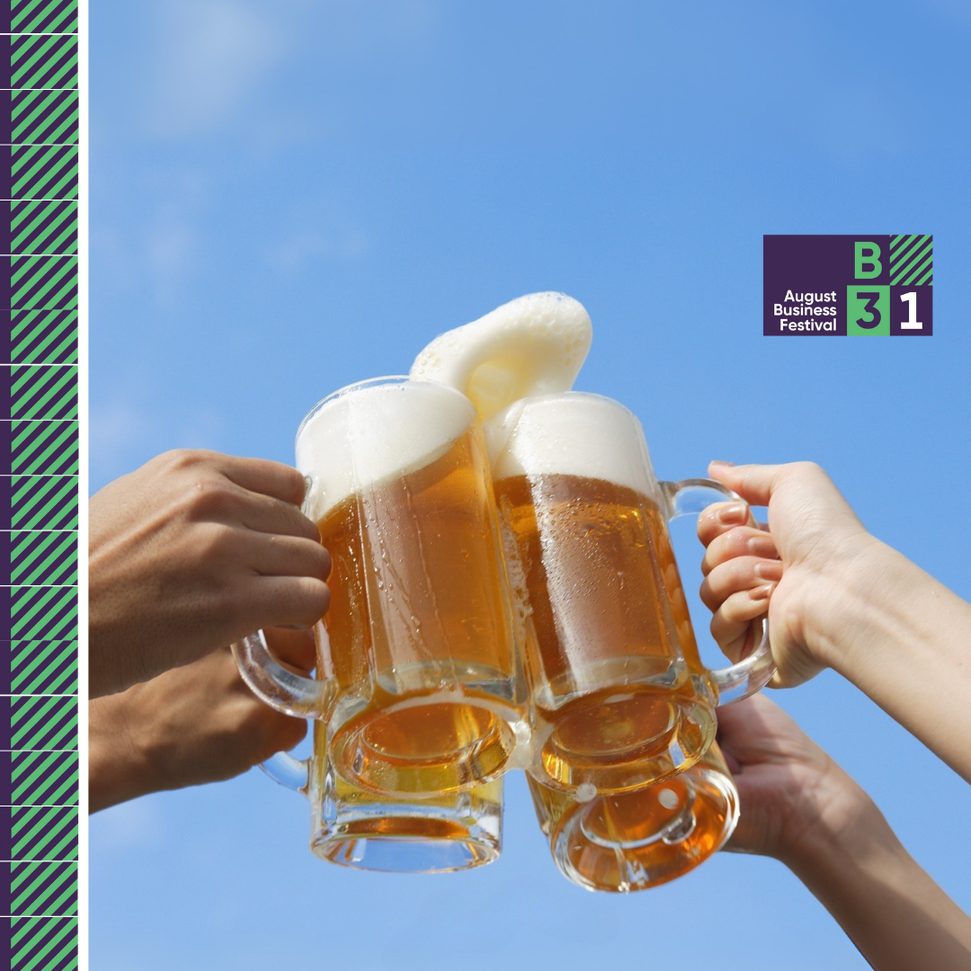 People clinking beer mugs at August Business Festival.