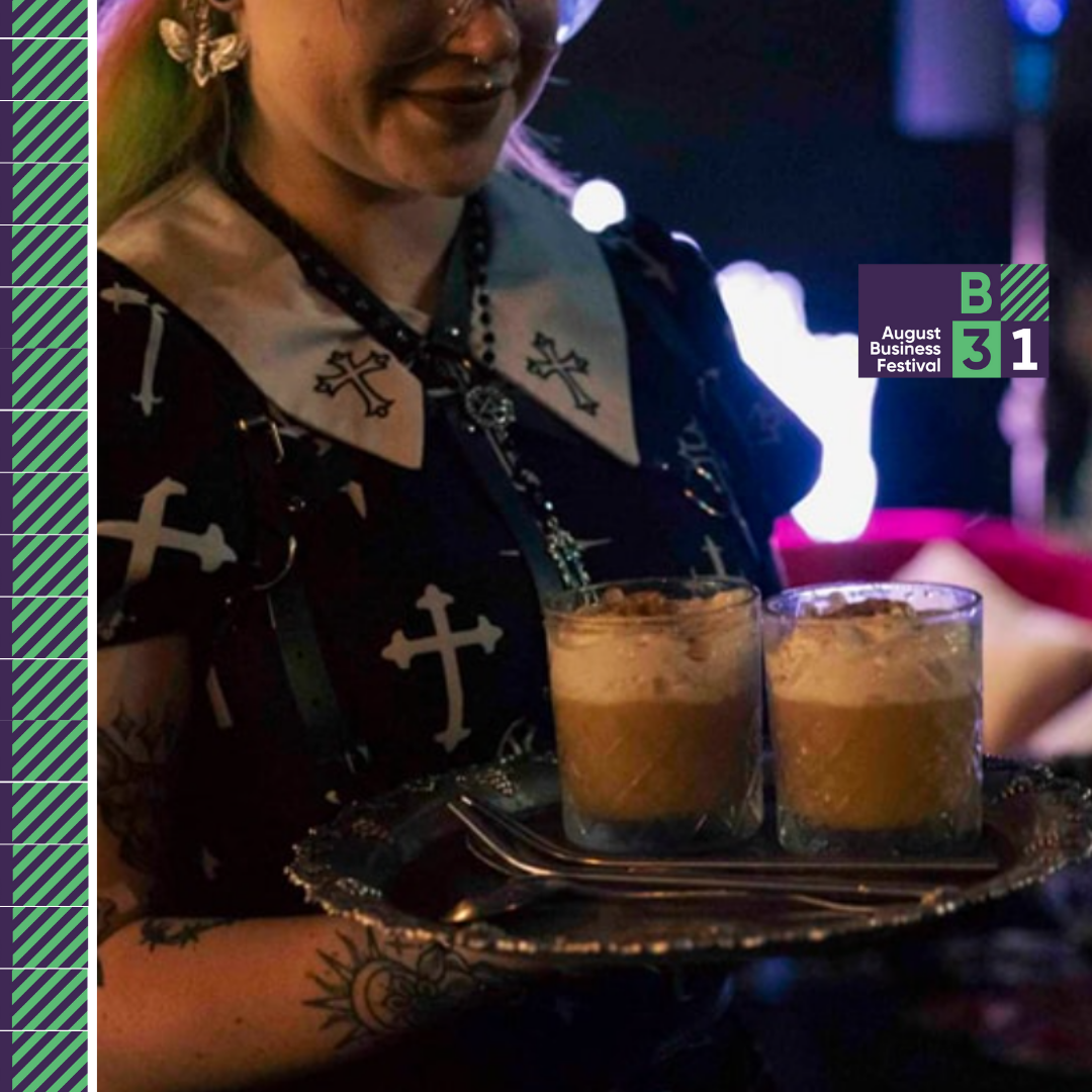 Server with desserts at business festival event.