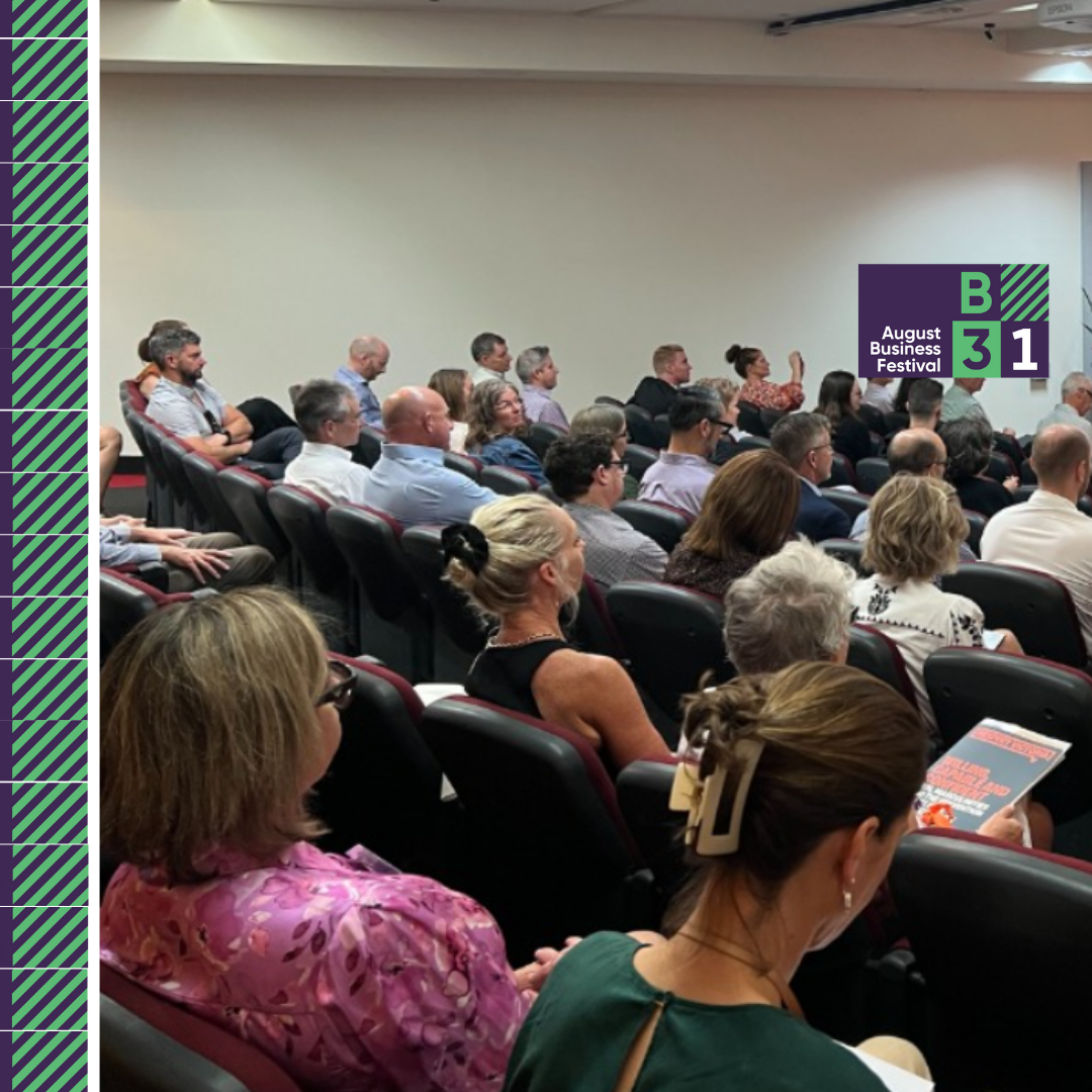 Audience attending August Business Festival presentation.