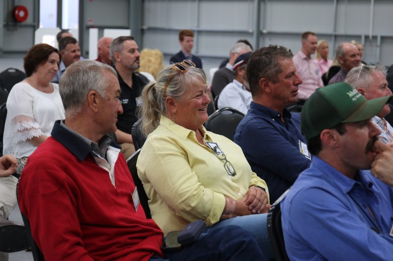 Audience attentively listening at a conference indoors.